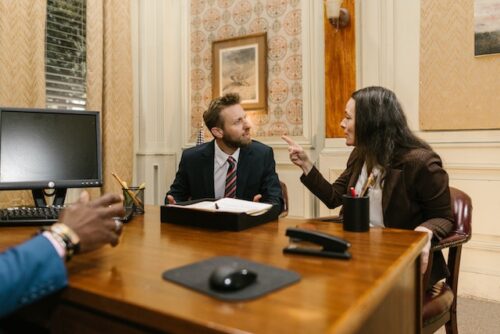 couple arguing in law office