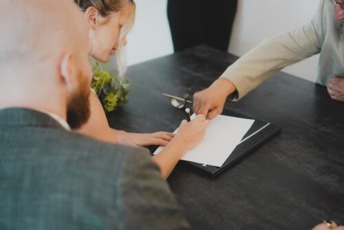 couple signing document