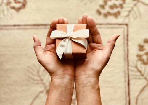 person holding gift box