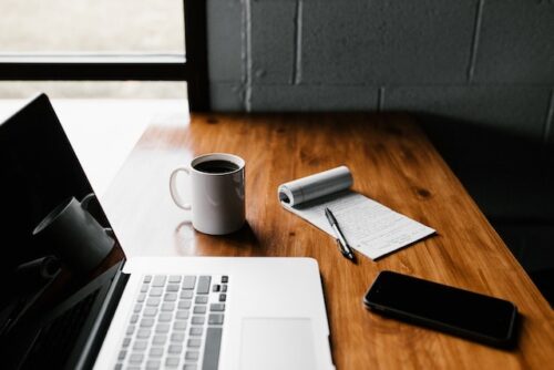 computer, coffee, and notepad