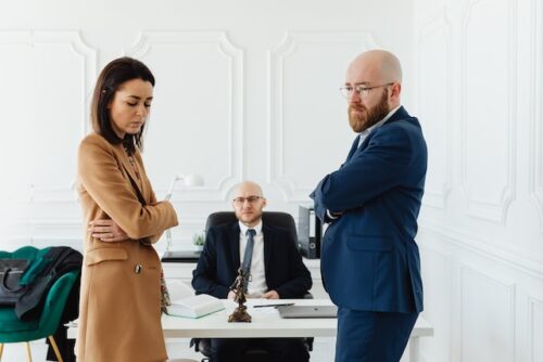 frustrated couple in front of attorney