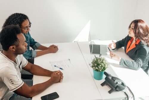 couple sitting at a table with attorney