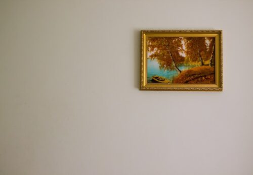 painting in gold frame on wall