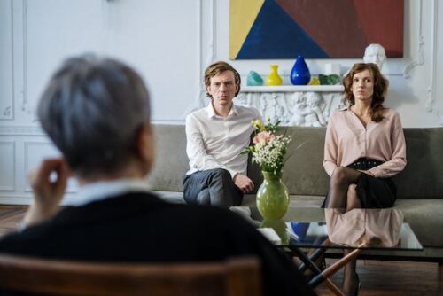 man and woman on couch