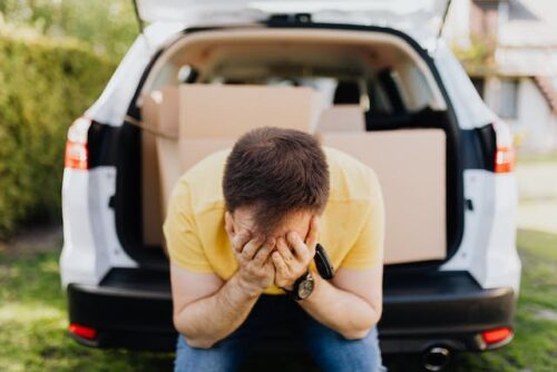 stressed man boxes in car