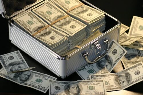 stacks of money in a suit case