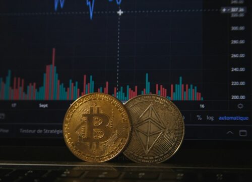 coins representing cryptocurrency in front of screen